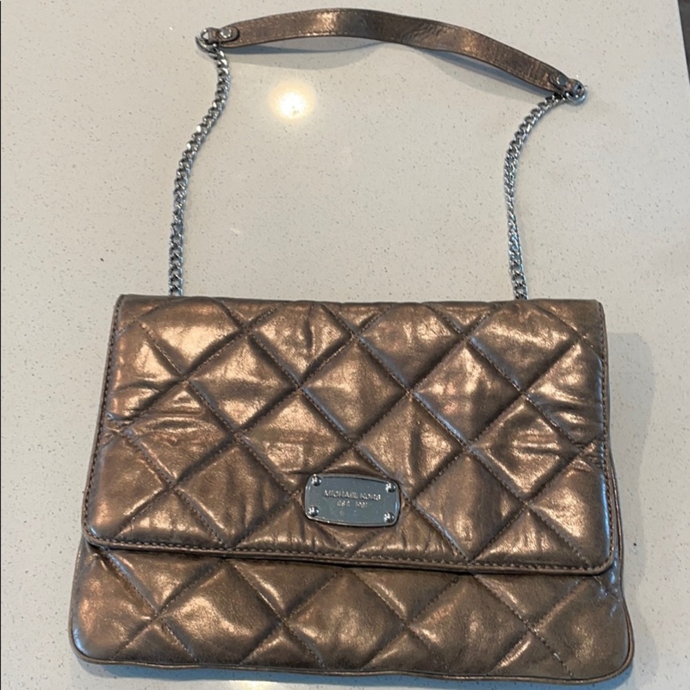 Michael KORS silver quilted clutch with strap